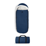 Blue sleeping bag with white interior and black handle on a white background